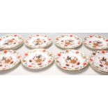 A group of vintage Royal Crown Derby Asian Rose pattern plates each being decorated with red and