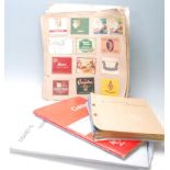 A collection of vintage Cigarette packets / cut outs stored within multiple albums. Packets