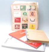 A collection of vintage Cigarette packets / cut outs stored within multiple albums. Packets