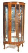 A 1930's art deco walnut veneered china display cabinet / vitrine. Raised on cabriole legs with