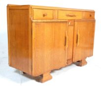 A vintage 1930's Art Deco oak dresser - sideboard having three short drawers over two cupboards at