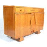 A vintage 1930's Art Deco oak dresser - sideboard having three short drawers over two cupboards at