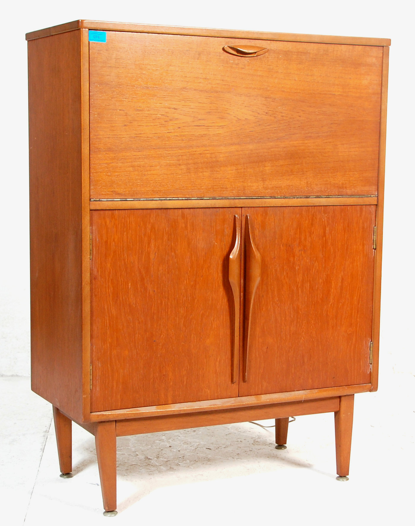 A retro vintage mid 20th century teak wood Danish manner drinks / cocktail cabinet of two tiered