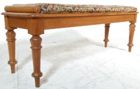 A 19th century Victorian oak window seat / hall bench having a rectangular top with cylindrical