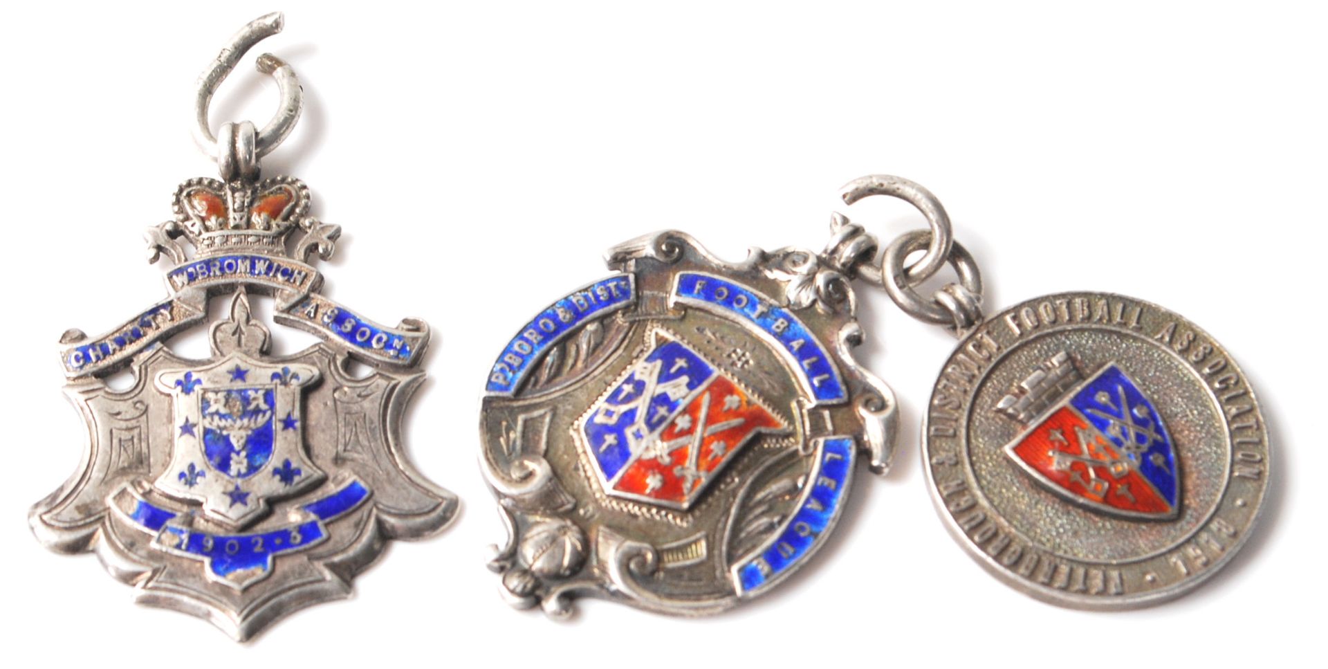 A group of three vintage silver hallmarked fob medals to include two Peterborough & District