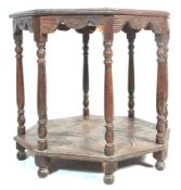 A 19th Century Victorian oak centre table of octagonal form having a carved table top over six