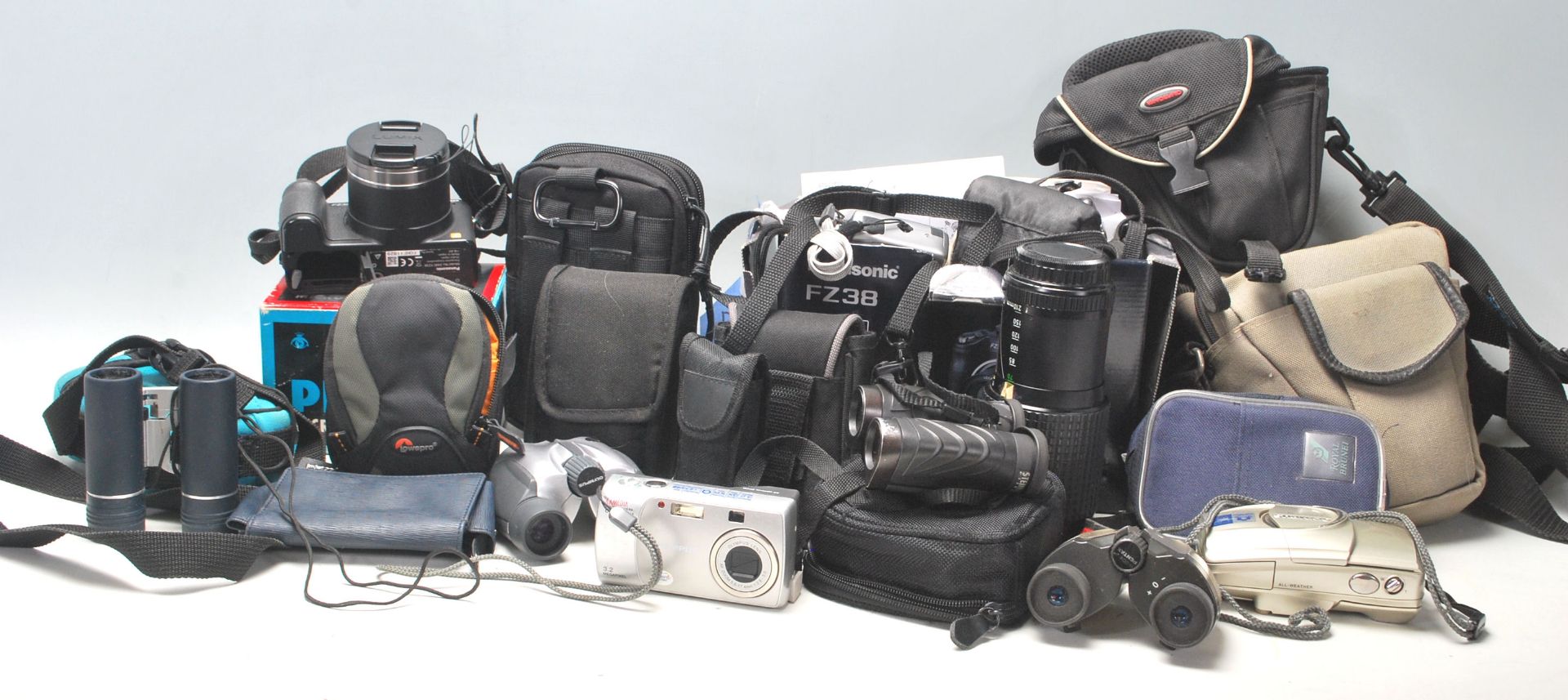 A collection of vintage retro camera equipment to include a Pentax P30, Lumix FZ38, SMC PENTAX- A