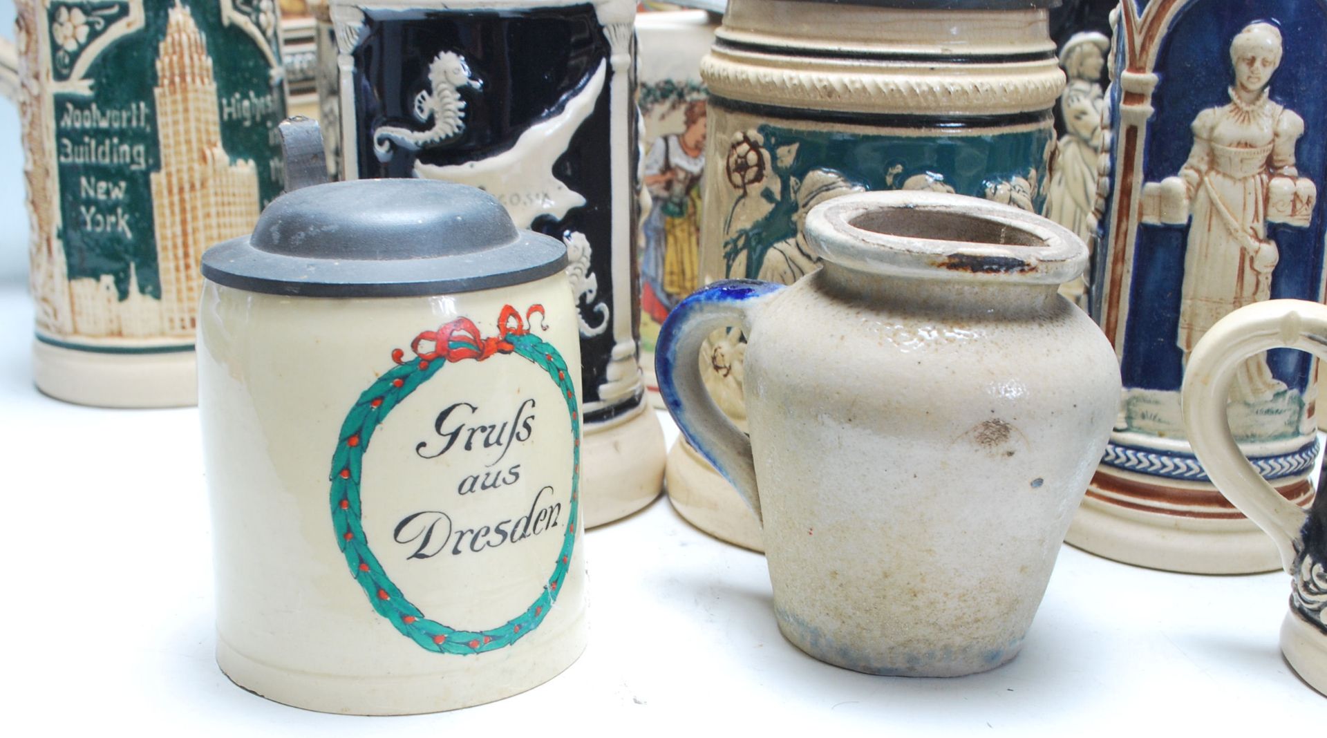 A large collection of German blue and grey stoneware jugs and beer steins, some having pewter - Image 3 of 11