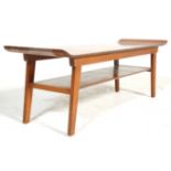 A retro vintage, mid cenutry teak surfboard style coffee occasional table. The table having raised