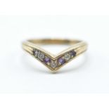 A stamped 375 9ct gold wishbone ring being set with alternate white and purple stones. Weight 3.