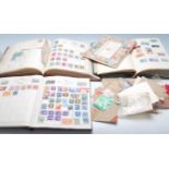 A collection of world stamps across multiple albums to include Great British stamps dating from