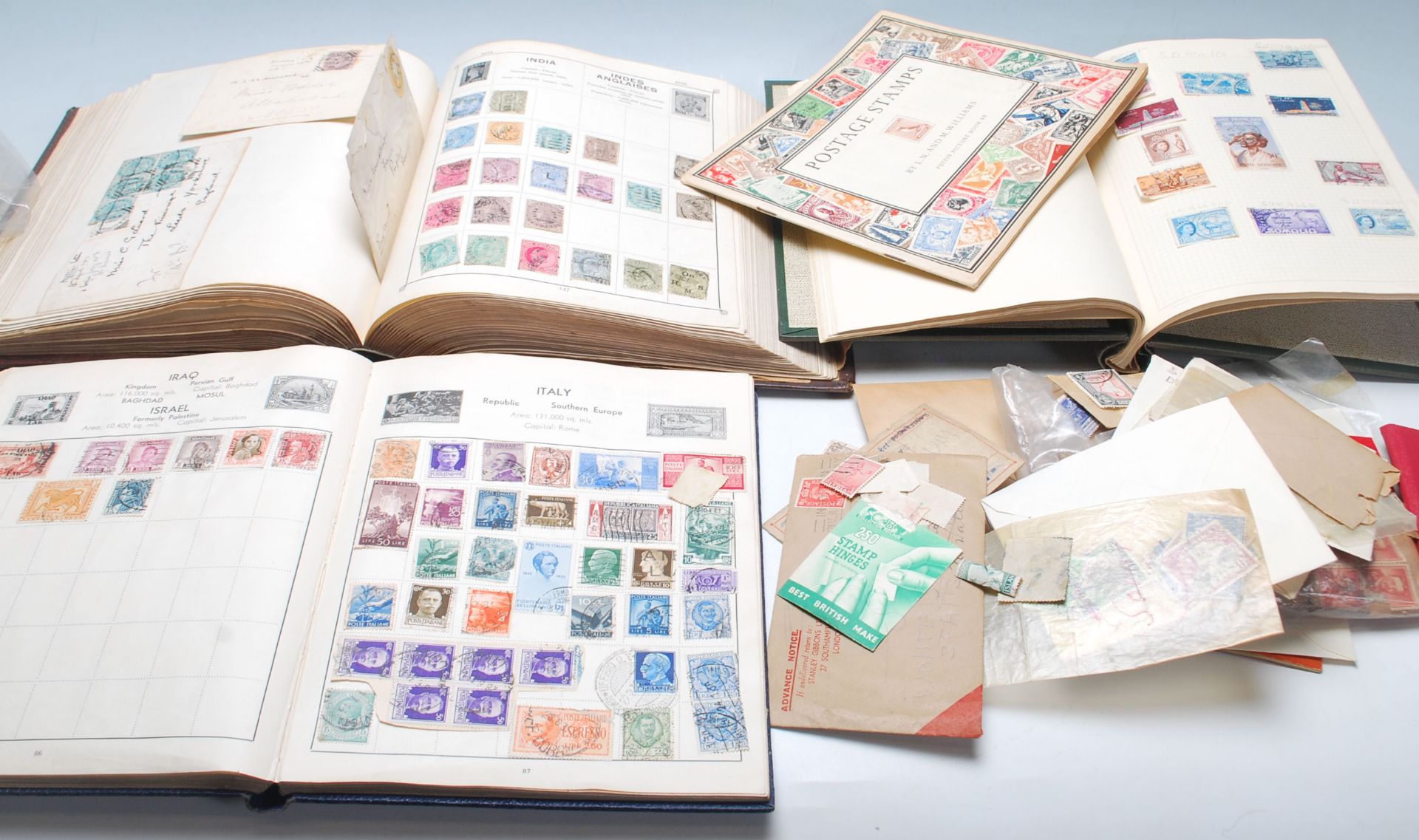 A collection of world stamps across multiple albums to include Great British stamps dating from