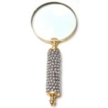 An Edwardian early 20th century magnifying glass having a white metal pebble decoration to the