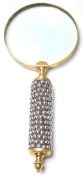 An Edwardian early 20th century magnifying glass having a white metal pebble decoration to the