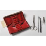 A collection of antique early 20th Century medical instruments, two of which marked Evans,