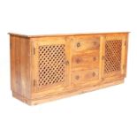 A 20th century Mexican contemporary pine sideboard / dresser base  having a central bank of three