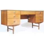 A vintage retro 1970's teak wood kneehole desk / dressing table of Danish influence with central