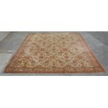 A large early 20th century Persian Islamic rug having red and brown ground with foliate decoration
