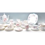 A selection of Royal Albert English bone china tea sets to include Rose Time pattern tea cups,