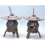 A pair of 20th century cast iron Chinese pagoda lanterns in pumpkin form  having pierced body