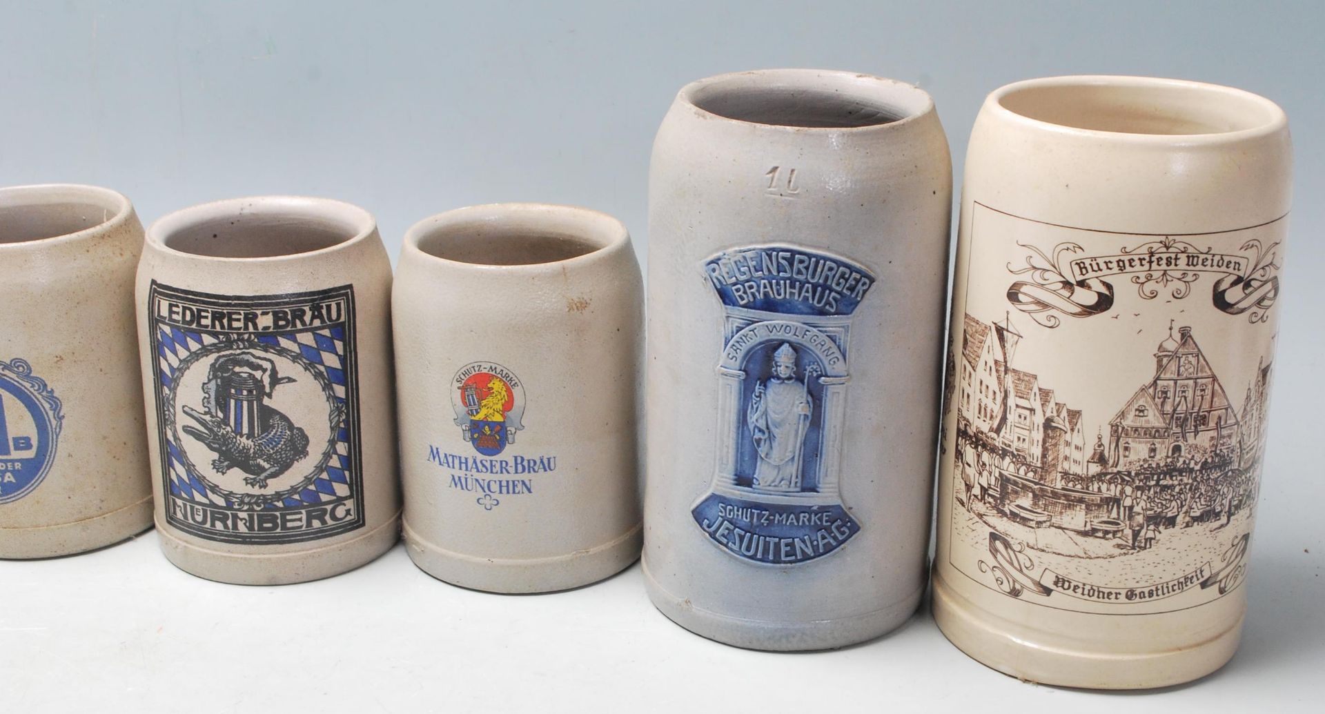 A large collection of 20th Century German blue and grey stoneware jugs and beer steins all having - Image 7 of 7