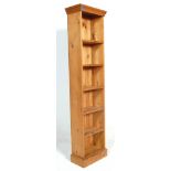 An antique style large country pine tall open window bookcase cabinet. Raised on plinth base with