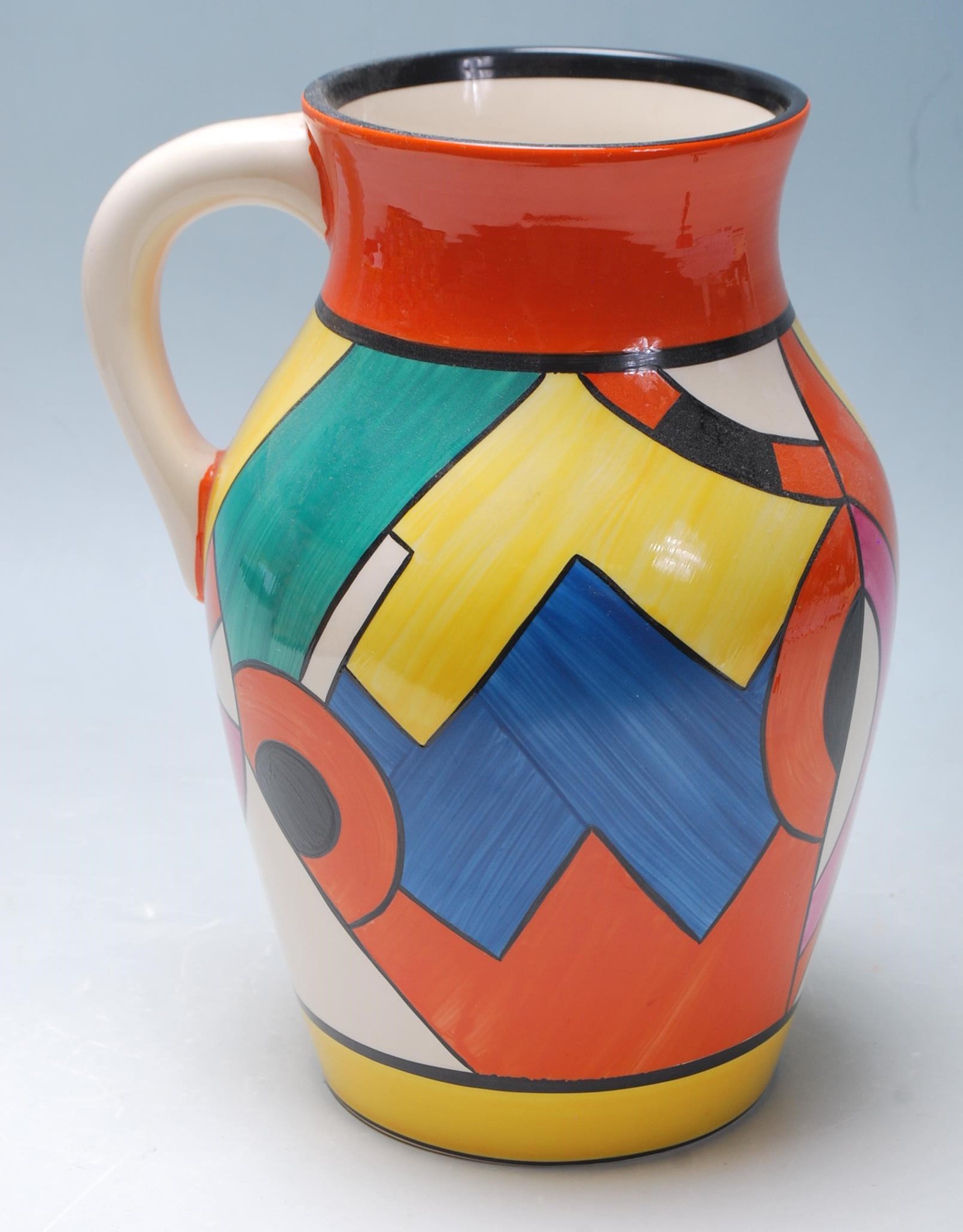 A Wedgwood Bizarre by Clarice Cliff Blue 'W' jug being hand painted with geometric decoration to the - Image 2 of 14