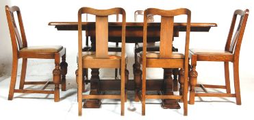 A 1930's Art Deco vintage oak extendable draw leaf dining table and 6 chairs. The table having a