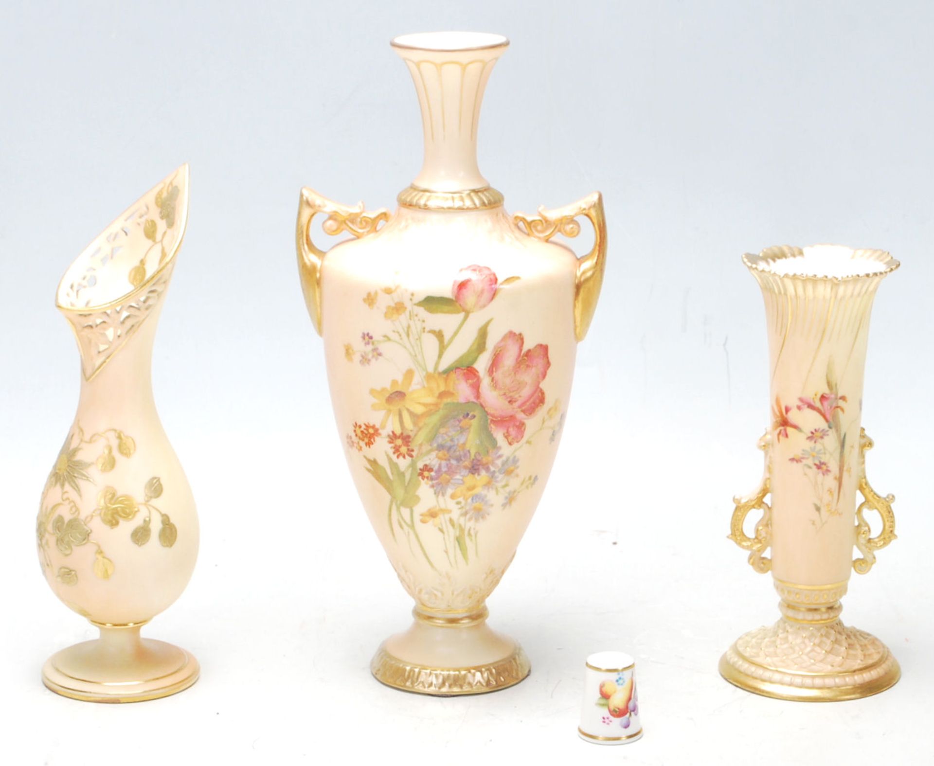 Group of Three Royal Worcester blush ivory vases, hand painted with flowers and gilded decoration,