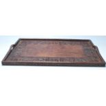 An early 20th Century Chinese Qing Dynasty style carved hardwood rice wine serving tray decorated