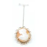 A hallmarked 9ct gold mounted cameo brooch having a carved cameo penel centre within an open work