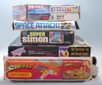 A collection of five vintage games to include Atomic Pinball by TOMY, Space Attack by Action GT,