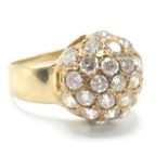 A stamped 375 9ct gold ring having a spherical head being set with round cut white stones. Weight