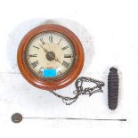 An early 20th century Postmans  / Post Office clock having a mahogany body with a single pine cone