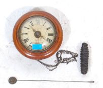 An early 20th century Postmans  / Post Office clock having a mahogany body with a single pine cone