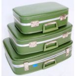 A good set of vintage retro 1960's graduating set of  suitcases finished in green with an