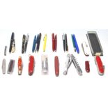 A good collection of writing pens and a Swiss penknife to include Parker pen, ball pen, fountain