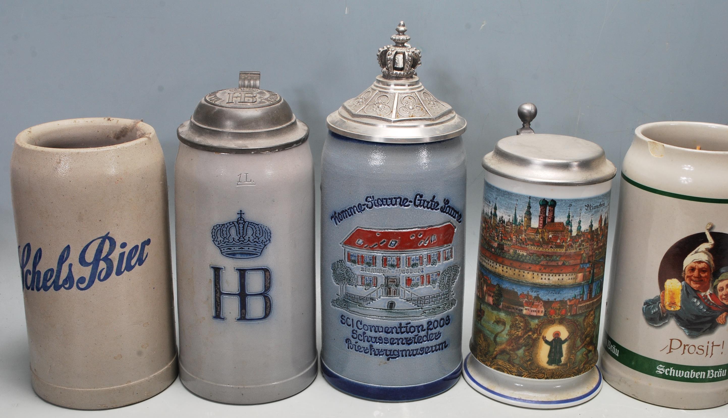 A large collection of German blue and grey stoneware jugs and beer steins, some having pewter - Image 4 of 10