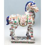 A 20th Century Chinese oriental Tang horse statue in the manner of Tang Dynasty with famille verte