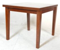 A vintage retro mid century  extendable draw leaf dining table having a panelled top with a hinged