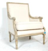 A 19th Century style French fauteuil armchair having a shabby chic painted wooden frame with