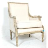 A 19th Century style French fauteuil armchair having a shabby chic painted wooden frame with