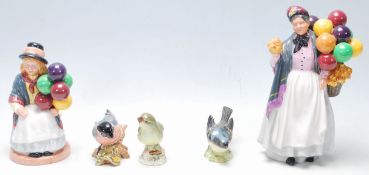 Two 20th Century Royal Doulton figurines to include Balloon Girl HN 2818 and Biddy Pennyfarthing