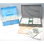 Two mid 20th Century Oriental Mahjong set, one set having plastic pieces with clear flower