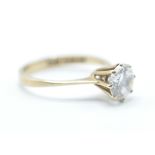 A hallmarked 9ct gold solitaire ring having a prong set round cut white stone. Hallmarked London