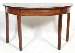 An early 19th century George III mahogany D end / demi-lune side console table having a rounded edge