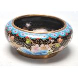 A 20th Century Chinese Cloisonne dish of round from having enamelled decoration throughout depicting