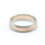 A hallmarked 9ct gold two tone band ring having a central band of rose gold within white gold