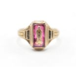 A 9ct gold mid 20th Century class graduation ring having a central rectangular cut pink stone with