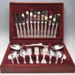 A vintage 20th Century 1970s oak cased silver plate / stainless steel canteen of cutlery by
